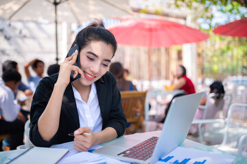 Trader use laptops connected to the internet from smartphones to trade stocks through Wi-Fi hotspot network technology