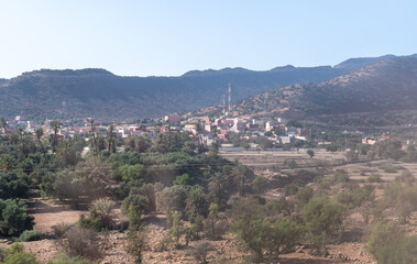Obraz premium Morocco semi-deserts and mountains, north africa nature, Moroccan stone desert, red hills, villages and argan trees