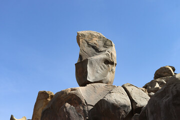 Fototapeta premium Ancient egyptian carvings and hieroglyphs on granite rocks near Famine Stela in Aswan, Egypt 