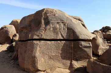 Ancient egyptian hieroglyphs carved on Famine Stela near Aswan, Egypt 