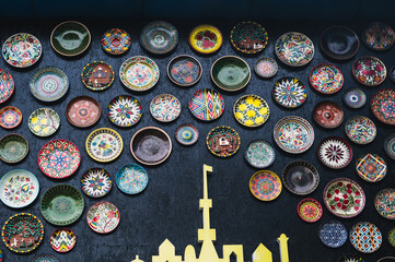 traditional Uzbek plates lyagans are decorated with oriental ornaments on wall of cafe Central Asian Pilaf Center Besh Qozon in Tashkent in Uzbekistan