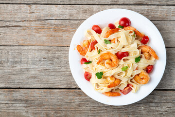 Italian pasta with shrimps , parmesan and tomatoes