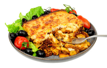Pastitsio pasta meal with fresh salad and black olives