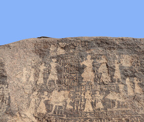 Ancient egyptian carvings and hieroglyphs carved on Famine Stela stones in Aswan, Egypt 