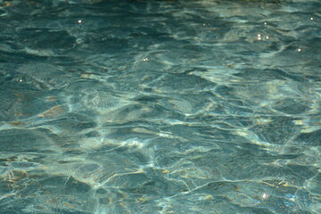 Transparent pleasant blue water in summer
