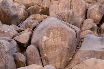 Ancient egyptian hieroglyphs carved on Famine Stela near Aswan, Egypt 
