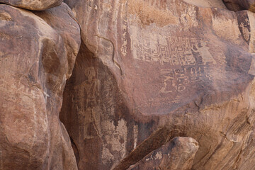 Ancient egyptian carvings and hieroglyphs on granite rocks near Famine Stela in Aswan, Egypt 