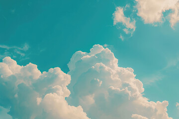 Naklejka premium Creamy white clouds drifting in a vibrant blue sky
