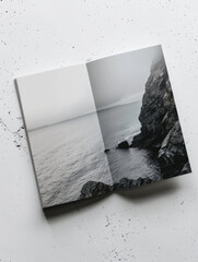 Minimalist climbing progress booklet against ocean backdrop