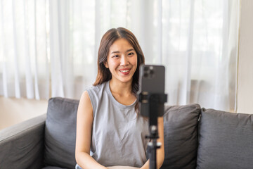 Portrait of smiling beauty asian woman posing look at camera making live selfie, content, vlogger, blogger, live video streaming, broadcast, podcast, online influencer and creator on smartphone