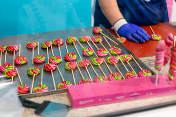 making colorful lollipops on a stick