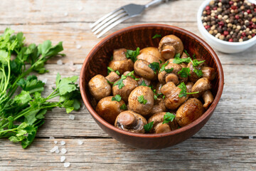 Fried mushroom champignon with onion and parsley