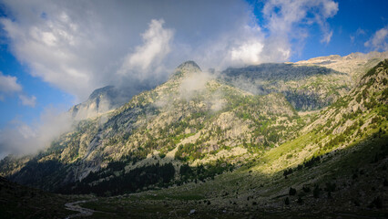 Morning fog in the Cavallers reservoir (Boí Valley, Aigüestortes i Estany de Sant Maurici National Park, Catalonia, Spain, Pyrenees)