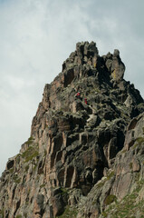 Some climbers doing a route in the Agulles de Travessani needles (Boí Valley, Catalonia, Spain, Pyrenees)