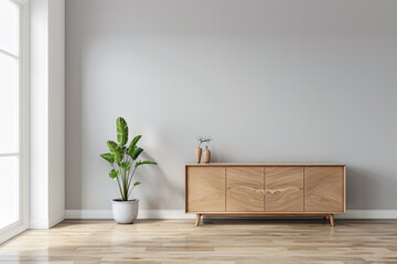 Stylish sideboard in a room with no people next to a window bathing the room with natural lighting. Elegant Real Estate interiors composition with minimal furniture.