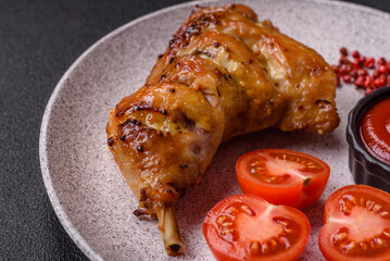 Delicious grilled chicken leg or quarter with salt and spices