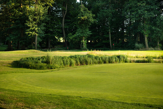 Golf course in green field