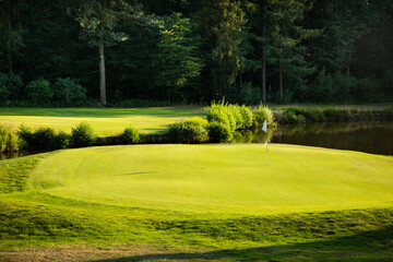 Golf course in green field