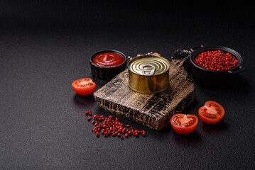 Round metal can with canned meat or fish with a key