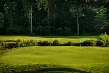 Golf course in green field