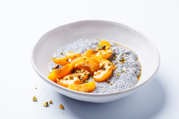 Chia pudding with caramelized apricot, maple syrup and pistachio.