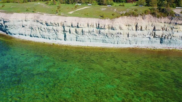 4K panoramic aerial video from flying drone to Panga coastal cliff and lighthouse , northern shore of Saaremaa island, near Kuressaare, Baltic Klint.Saaremaa , Estonia