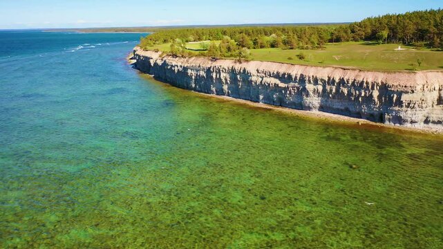 4K panoramic aerial video from flying drone to Panga coastal cliff and lighthouse , northern shore of Saaremaa island, near Kuressaare, Baltic Klint.Saaremaa , Estonia
