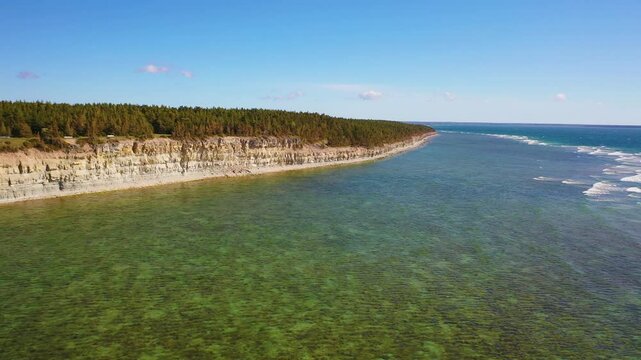 4K panoramic aerial video from flying drone to Panga coastal cliff and lighthouse , northern shore of Saaremaa island, near Kuressaare, Baltic Klint.Saaremaa , Estonia