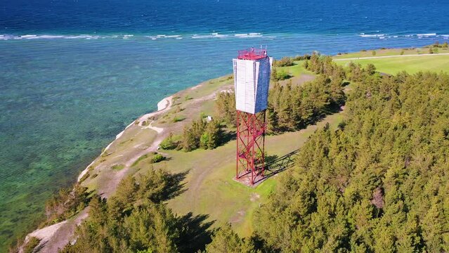4K panoramic aerial video from flying drone to Panga coastal cliff and lighthouse , northern shore of Saaremaa island, near Kuressaare, Baltic Klint.Saaremaa , Estonia