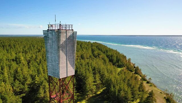 4K panoramic aerial video from flying drone to Panga coastal cliff and lighthouse , northern shore of Saaremaa island, near Kuressaare, Baltic Klint.Saaremaa , Estonia
