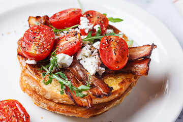 French toast with bacon, tomato, arugula and feta.