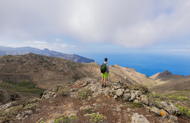 Boy hiking in the Teno Rural Park on the island of Tenerife.