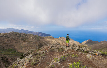 Boy hiking in the Teno Rural Park on the island of Tenerife.