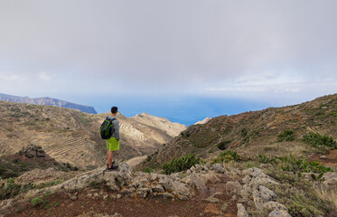 Boy hiking in the Teno Rural Park on the island of Tenerife.