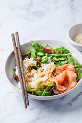 Poke salad - salmon with rice and cucumber.