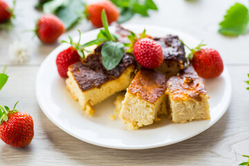 prepared cottage cheese casserole with fresh strawberries
