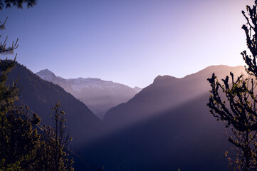 Sunrise in the mountains. Rising sun in the hills of Himalayan village Raila, Himachal Pradesh,...