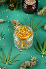 Top view of marijuana leaves and cannabis buds, cbd concept