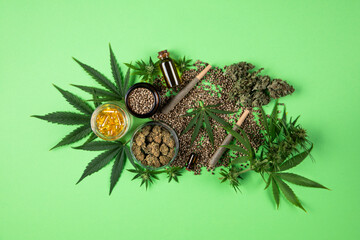 Marijuana leaves, bottle of oil, cannabis on cbd concept