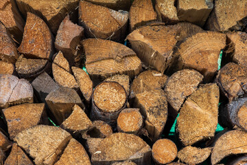 Cut wood for heating is stacked in a pile.