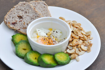 whole wheat bread or sourdough bread with nuts , avocado and soft boiled egg