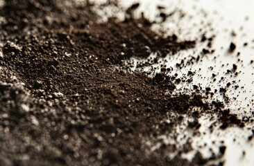 Dark Coffee Grounds on White Surface