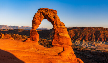 Delicate Arch - The most famous landmark of the Arches National Park in Utah in strong sunlight...