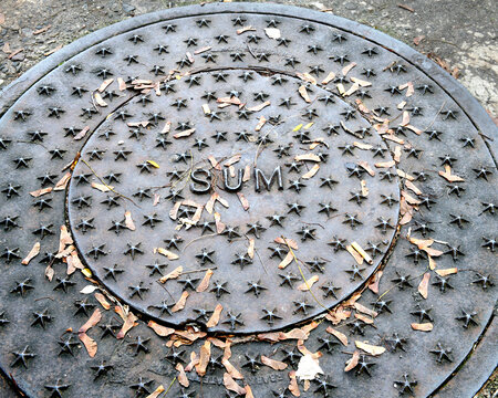 Manhole cover in the street of park, Mary Ellen Kramer Great Falls Park, City Of Paterson, New jersey, USA