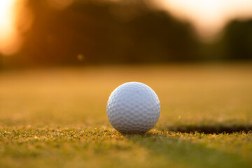 Closeup Golf ball on green grass on course, Sport and lifestyle
