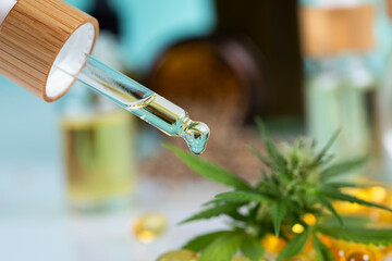 Set of essential oil cbd in a glass bottle, with a pipette, marijuana concept.