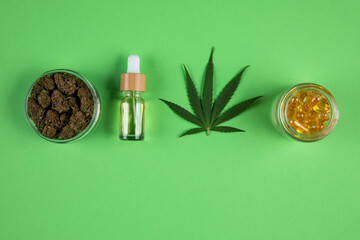 Marijuana leaves, bottle of oil, cannabis on cbd concept