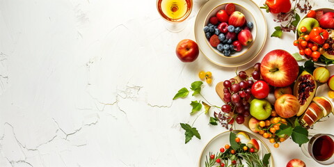 Top view of colorful autumn fruits and vegetables arranged on a white background, vibrant and fresh seasonal display, banner with copy space
