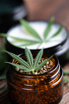 Cbd hemp cosmetics, oil in bottle and marijuana
