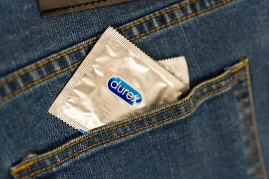 Samut Prakan, Thailand - June 30, 2024 : Durex condom in the pocket of blue jeans.